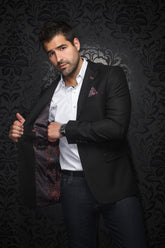 Veston noir texturé porté ouvert avec doublure rouge et orange à motif, vue de face sur mannequin pour homme par Au Noir