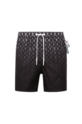 Isolated front view of men's black swim shorts with allover bunny skull print and white drawstring by Psycho Bunny