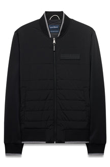 Veste coupe-vent mi-saison noire zippé à devant matelassé, col, poignets pour homme par Psycho Bunny, vue produit