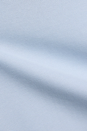 Polo manches courtes piqué bleu pâle avec pli façon couture et texture fine pour homme par Psycho Bunny, en gros plan
