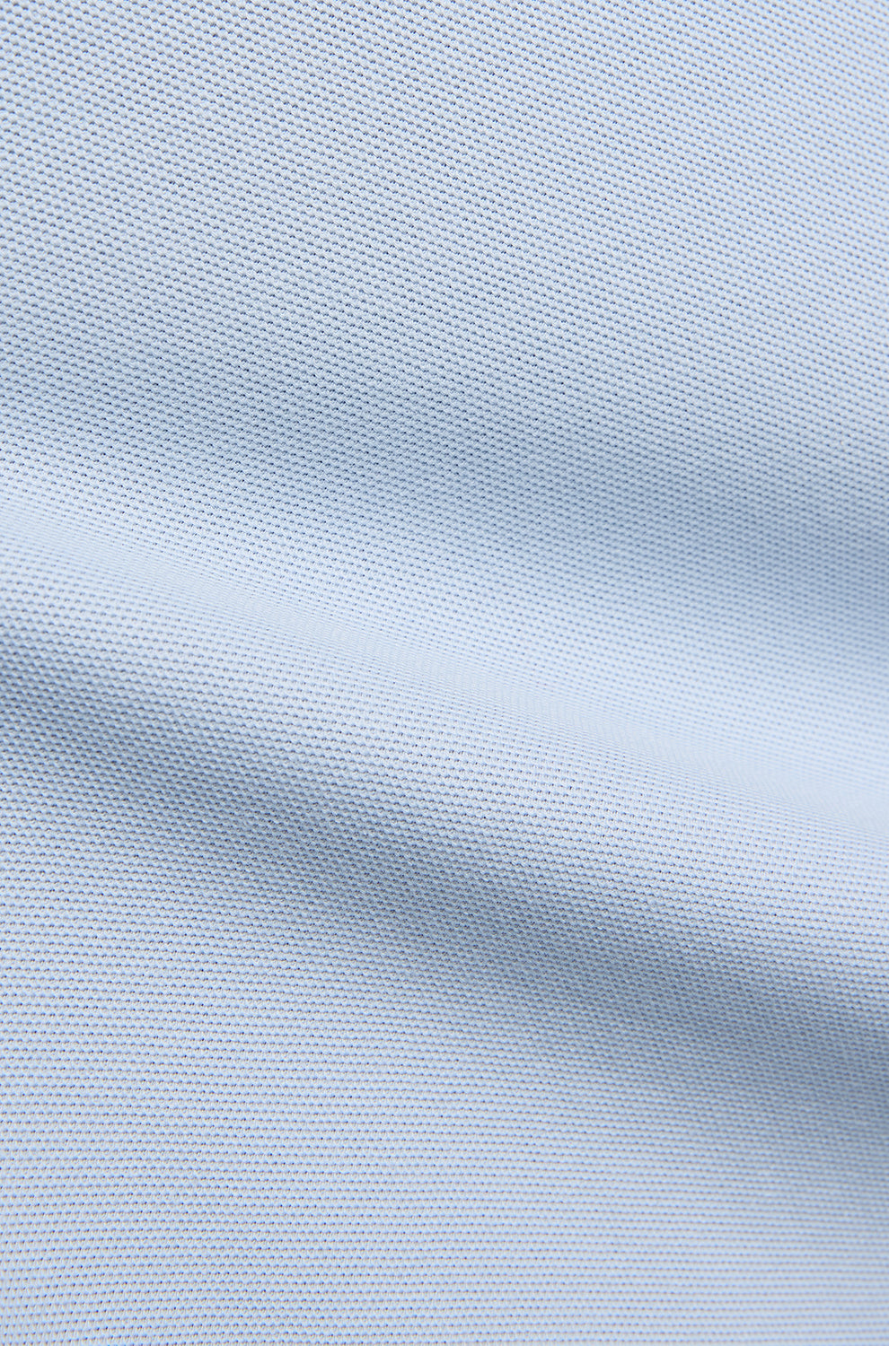 Polo manches courtes piqué bleu pâle avec pli façon couture et texture fine pour homme par Psycho Bunny, en gros plan