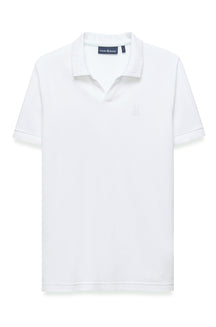 Polo blanc à manches courtes, vue de face, avec col côtelé et logo ton sur ton pour homme par Psycho Bunny