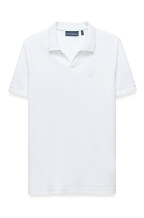 Polo blanc à manches courtes, vue de face, avec col côtelé et logo ton sur ton pour homme par Psycho Bunny