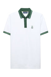 Polo blanc à manches courtes avec bordures verts, patte et col, vue produit pour homme par Psycho Bunny