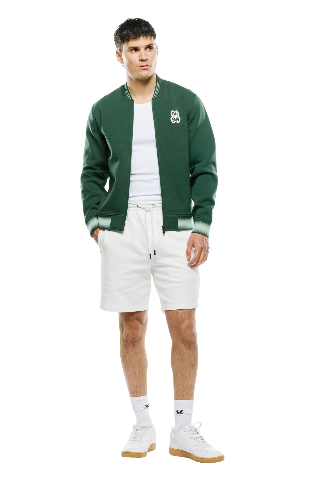Psycho Bunny men's full front model view of dark green zip bomber jacket with light green striped rib hem and cuffs
