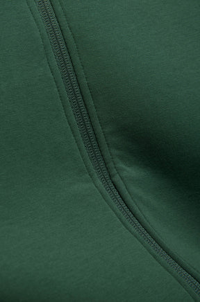 Psycho Bunny men's close detail of dark green knit fabric and matching zipper tape on the jacket front