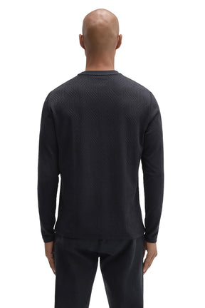 Back view of men's black long sleeve crew neck T-Shirt with tonal raised geometric texture by Robert Barakett