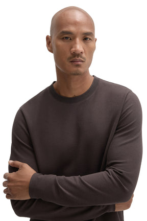 Men's close front detail of a dark brown textured crewneck Long-sleeve T-Shirt showing the ribbed collar by Robert Barakett