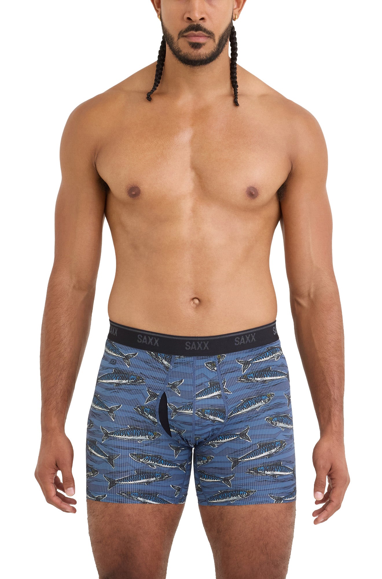 Front model view of men's blue fish-print boxer briefs with contoured pouch and black logo waistband by Saxx