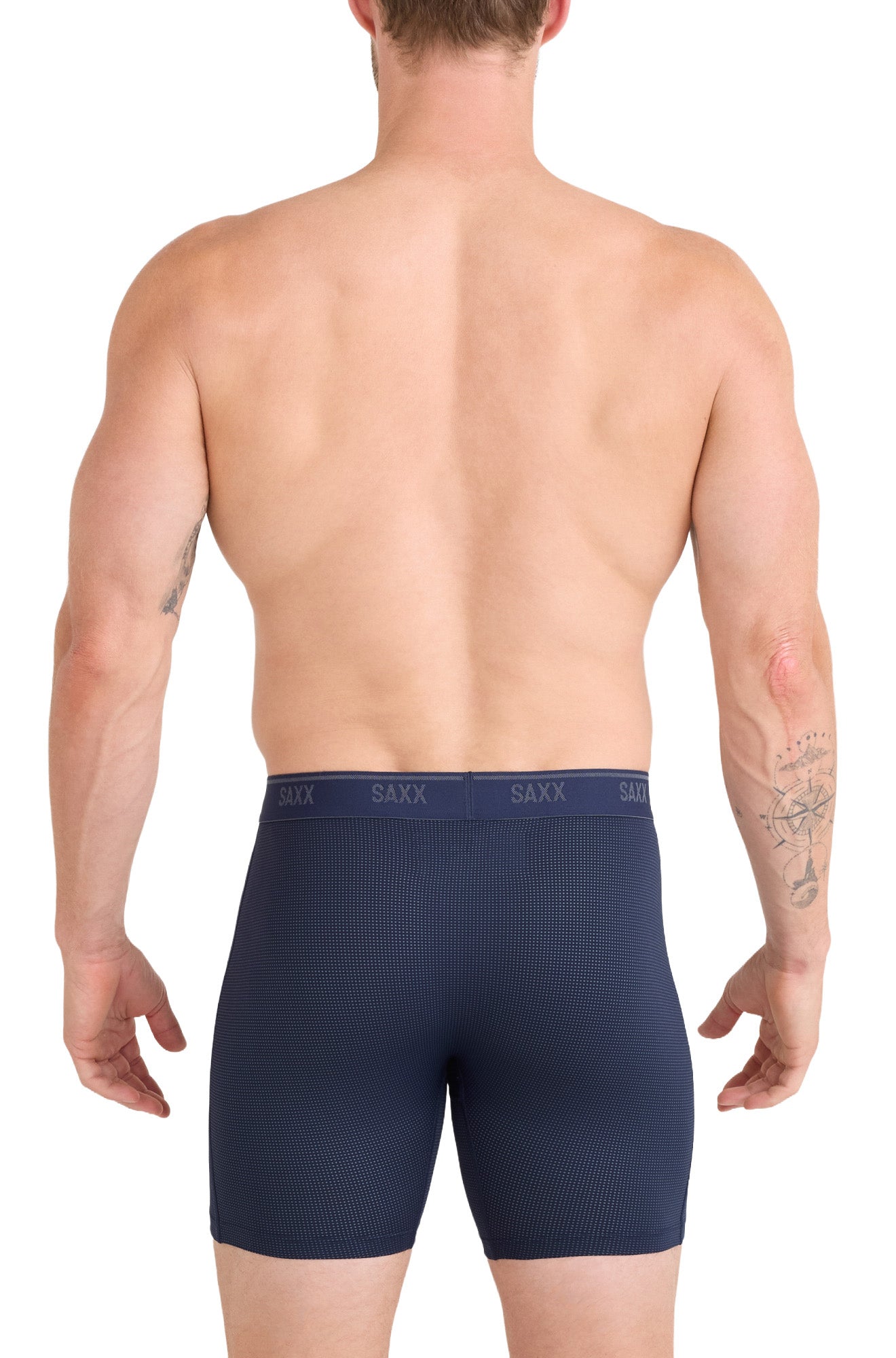 Men's navy boxer briefs with repeated SAXX waistband logos and micro-dot texture, back model view