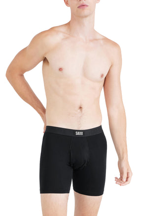 Men's black boxer underwear with contour pouch seams and SAXX logo waistband, front model view